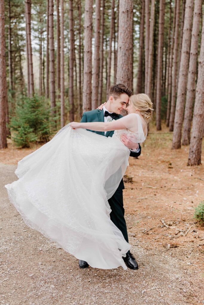 Wedding at Pinewood Weddings and Events. The couple got married surrounded by tall pine trees. This wedding is the perfect example of chic and timeless.