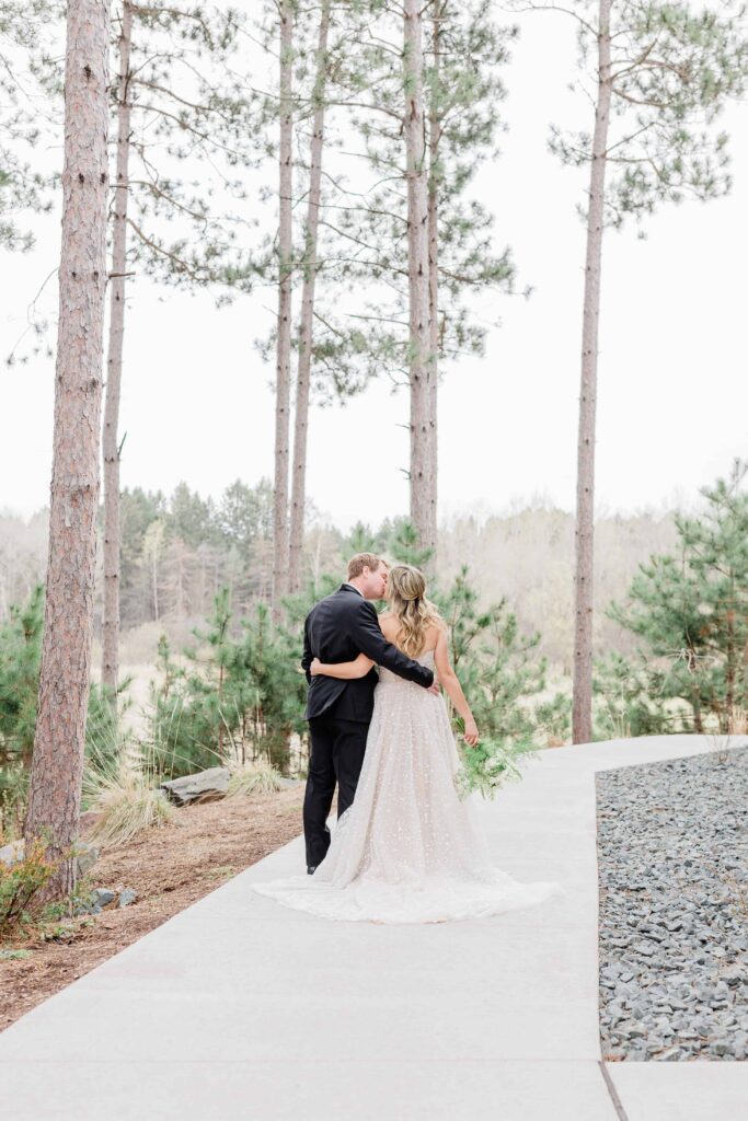 Wedding at Pinewood Weddings and Events. The couple got married surrounded by tall pine trees. This wedding is the perfect example of chic and timeless. 