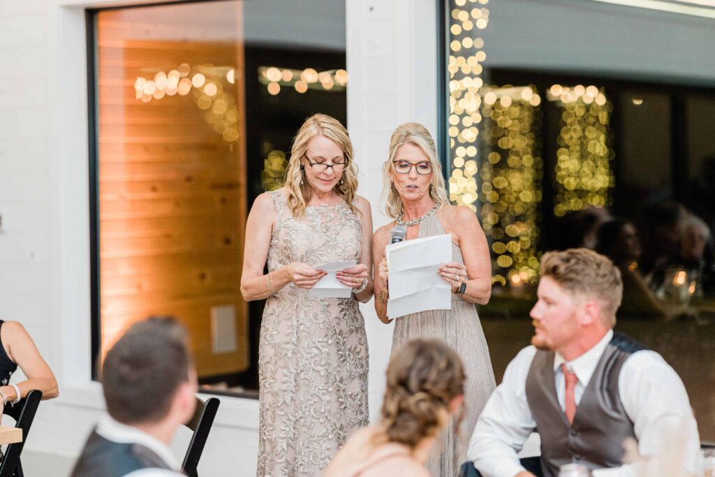 Mother of the bride and groom give a speech at the beautiful fall wedding. photo taken by Isa Wines Photography at La Pointe Events, Somerset Wisconsin. 