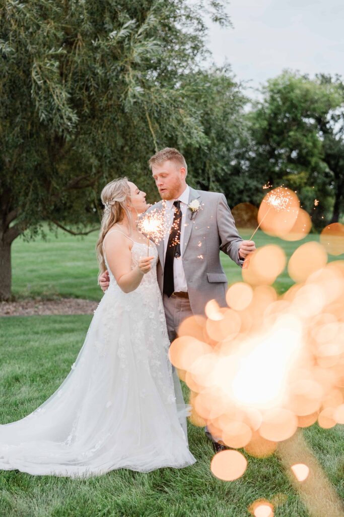 Husband and sparkler photos at Ridgetop, Prescott Wisconsin. Photo captured by professional wedding photographer Isa Wines Photography 