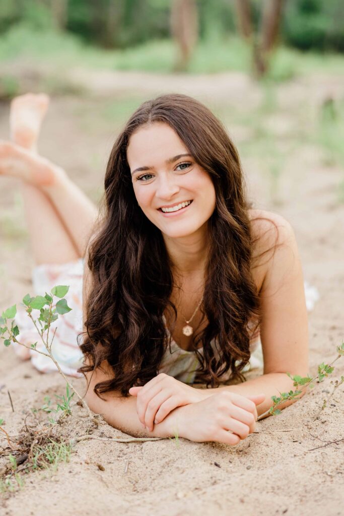 Ava. Class of 2024 Hudson High School senior being photographed at a beach in Afton Minnesota.